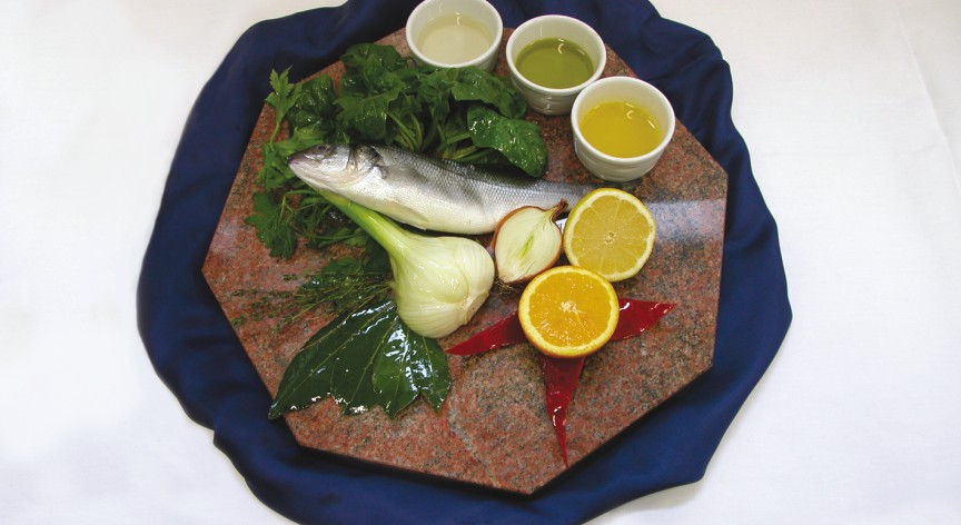 Involtino di spigola con spinaci e finocchi in salsa all’arancia